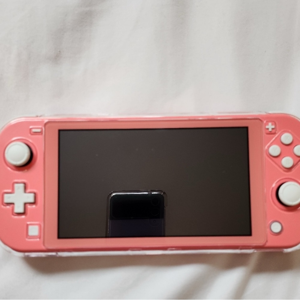 Nintendo Switch Lite - Coral with original charger et cover